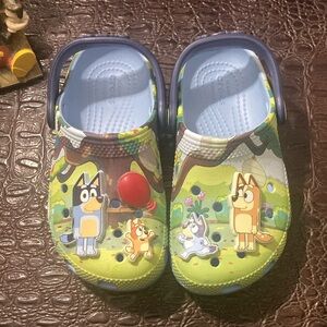 CROCS Blue and Green Sandals with Cartoon Design